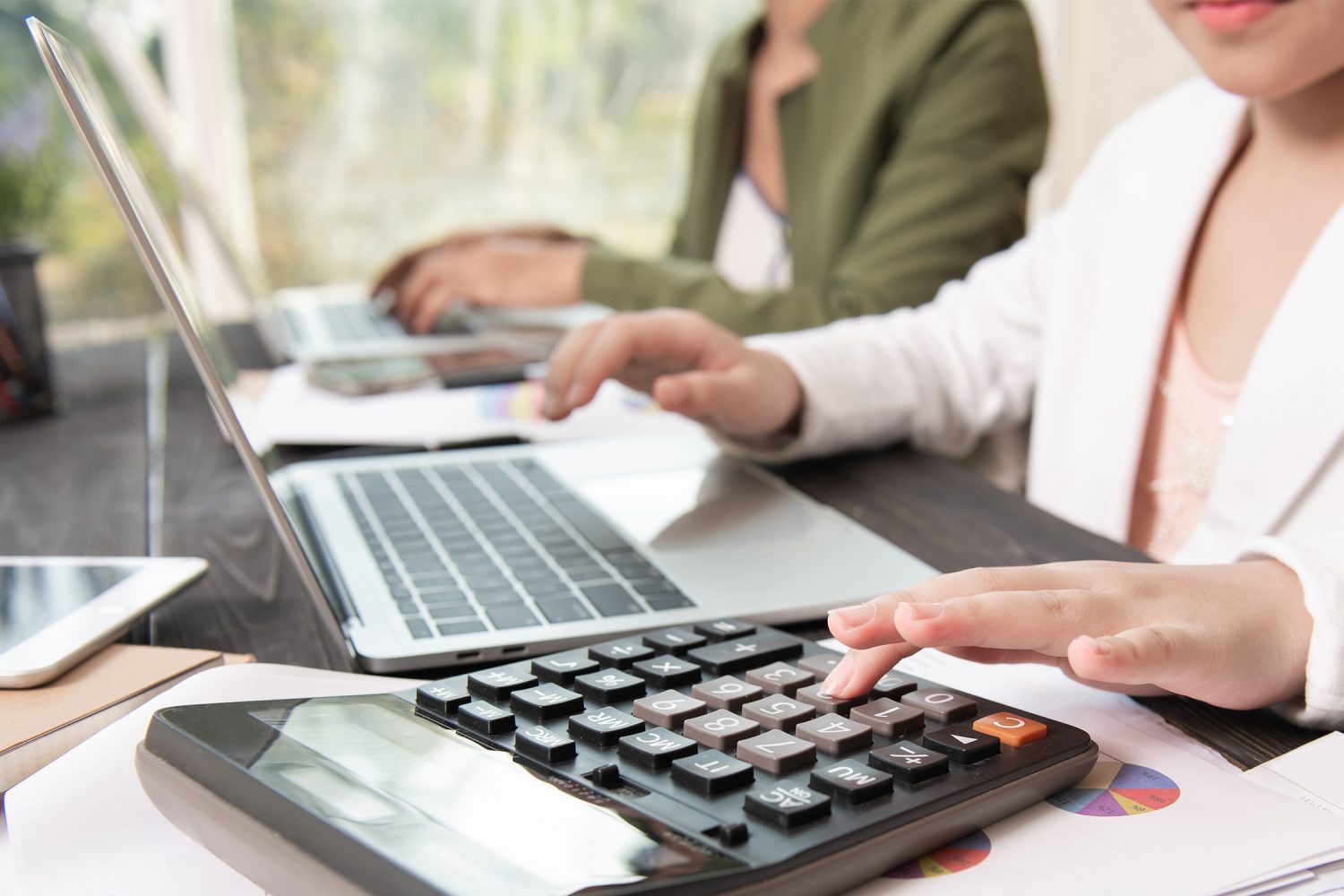 A person using a calculator