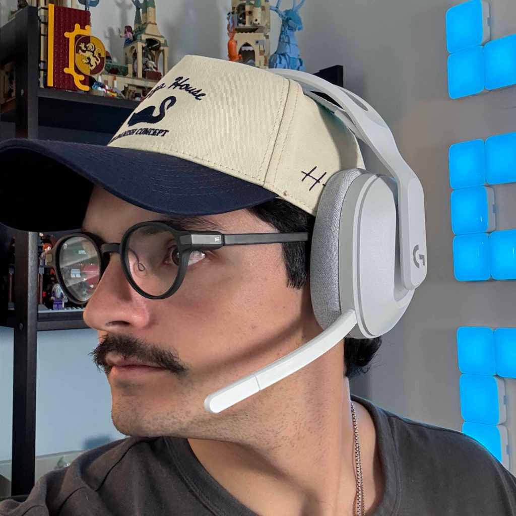 A man wearing a hat and headphones