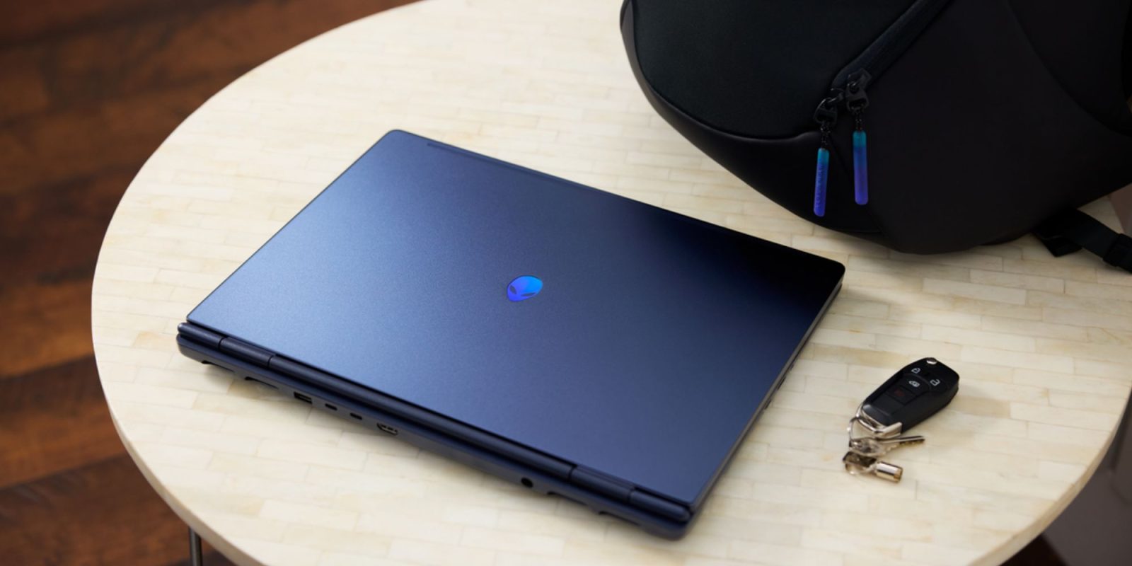 A laptop and a black cap