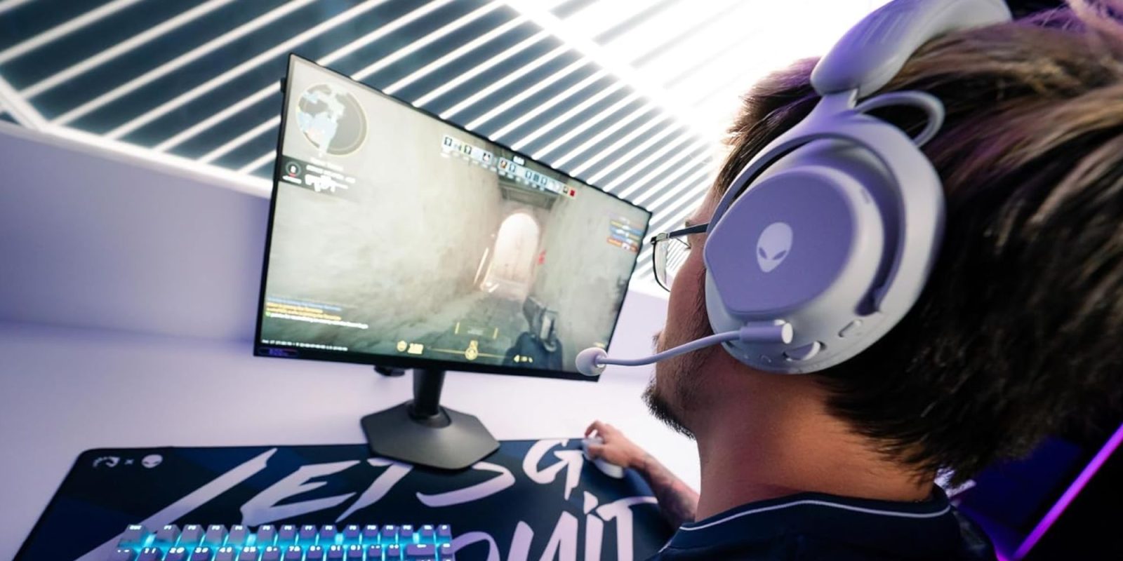 A man wearing headphones and a headset playing a video game