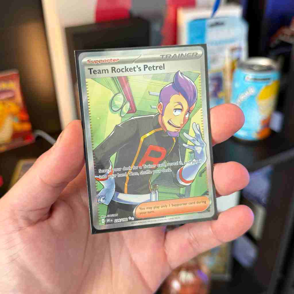 A hand holding a card