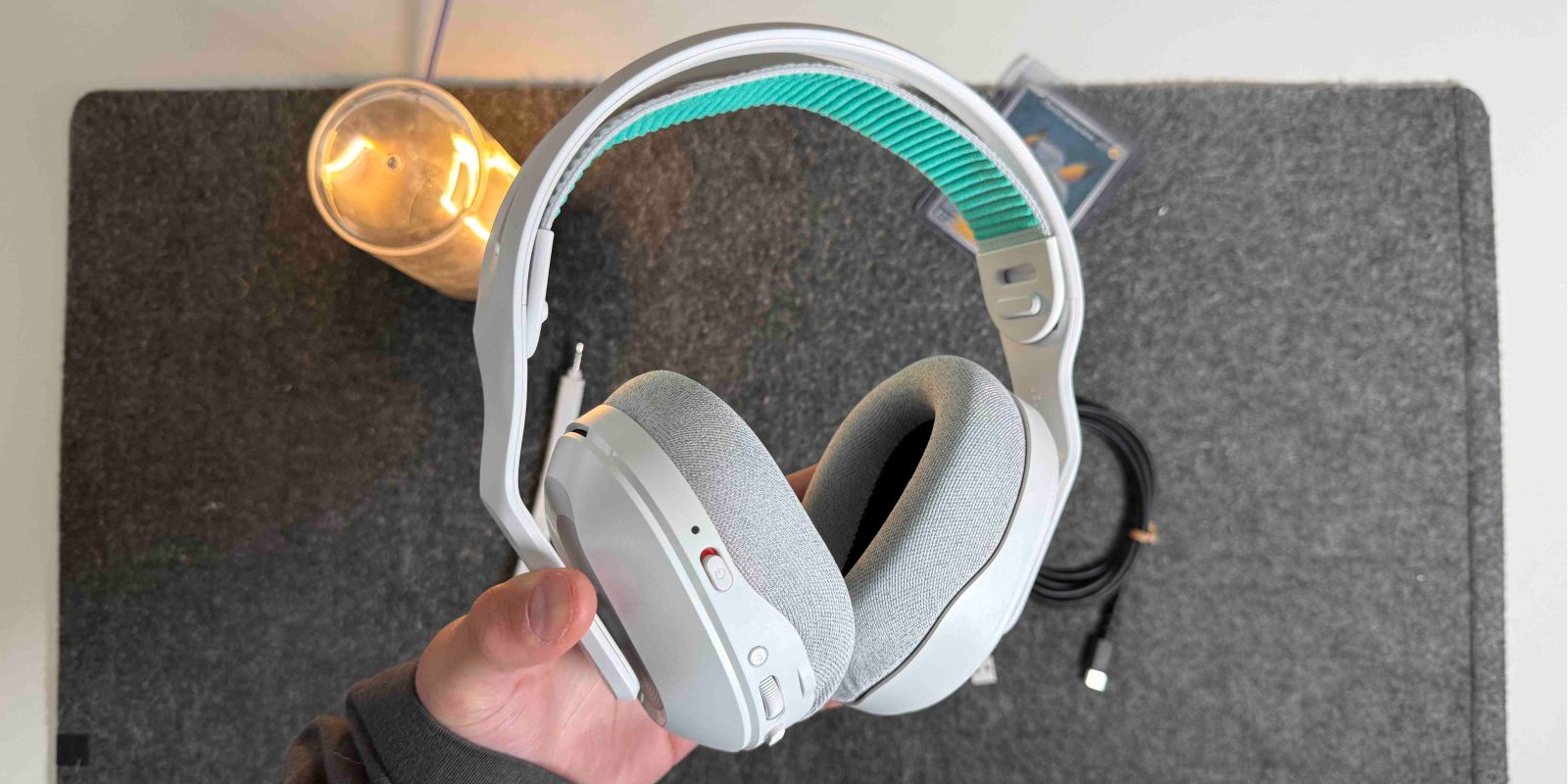 A person holding headphones