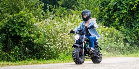 A woman riding a motorcycle