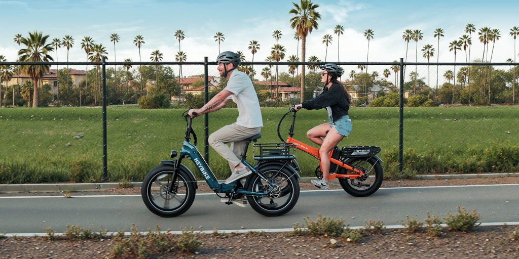 A man and woman riding bicycles