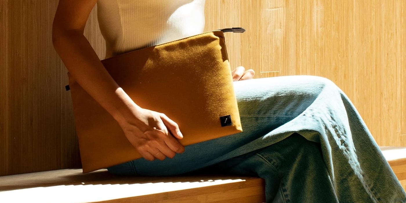 A person holding a laptop