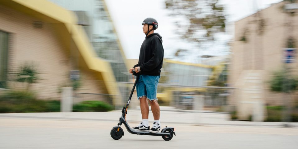 A man riding a scooter