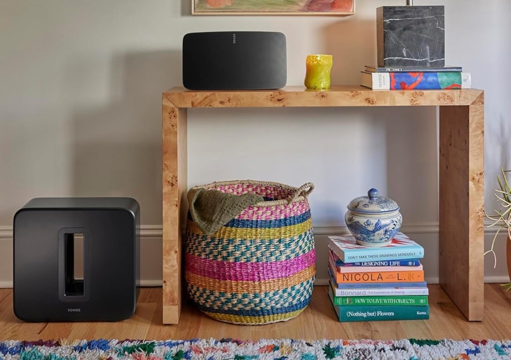 A shelf with a basket and books on it