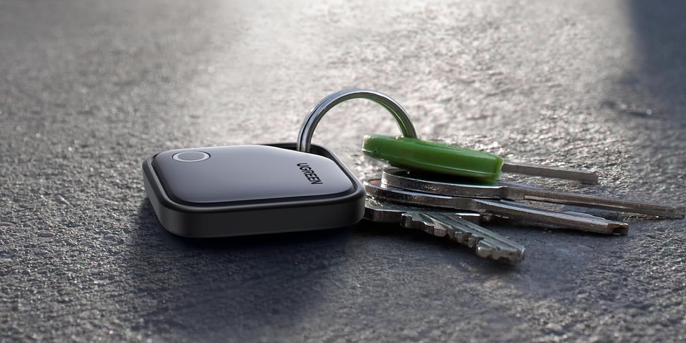 A key chain with a key ring and a green keychain