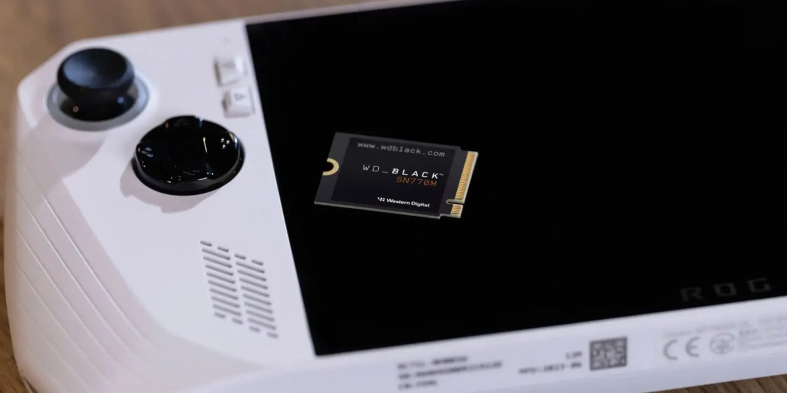 Image showing WD's compact 2230 SSD kept on an ASUS ROG Ally handheld.