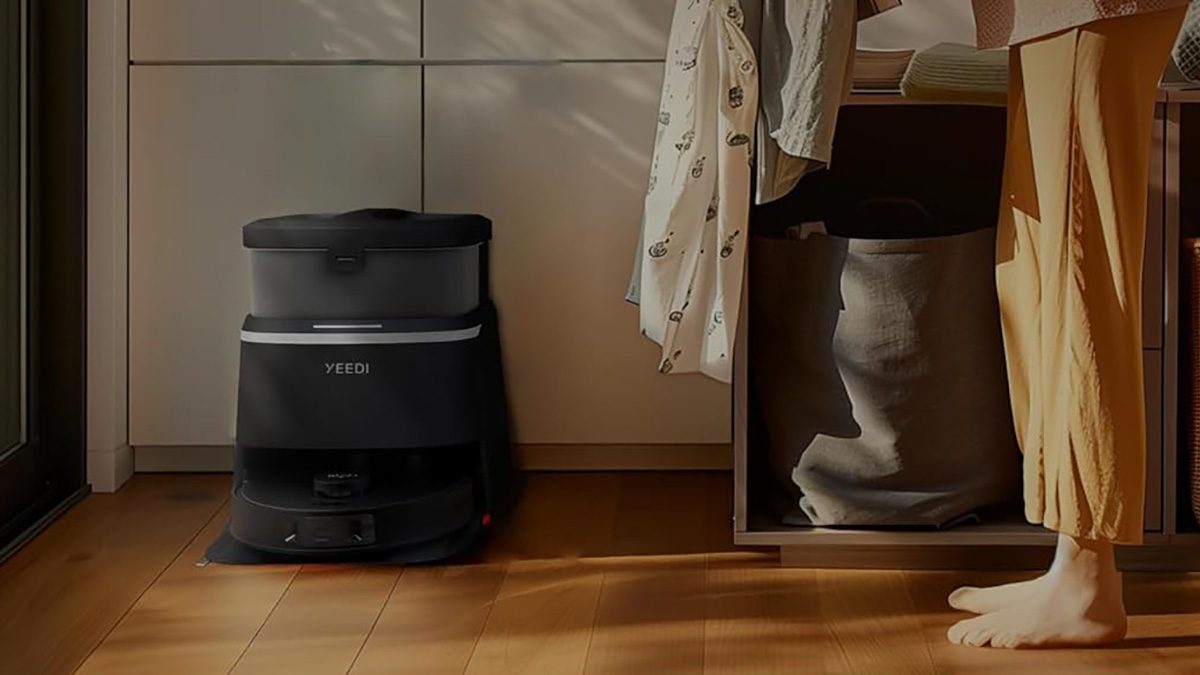 A black and grey object next to a wooden surface