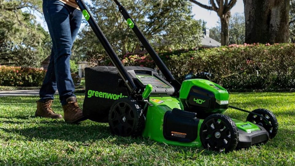 A person using a lawnmower