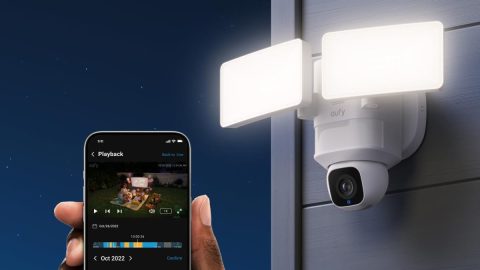 A hand holding a phone with a camera on it