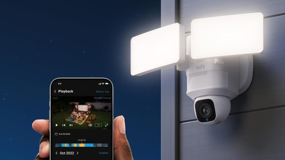 A hand holding a phone with a camera on it