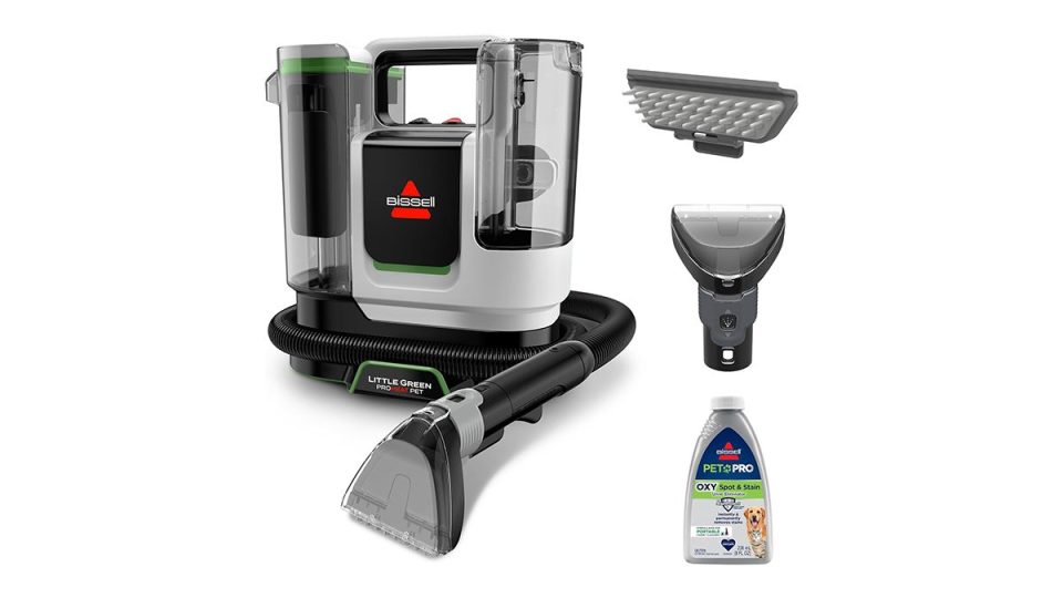 A vacuum cleaner and a bottle of cleaning agent