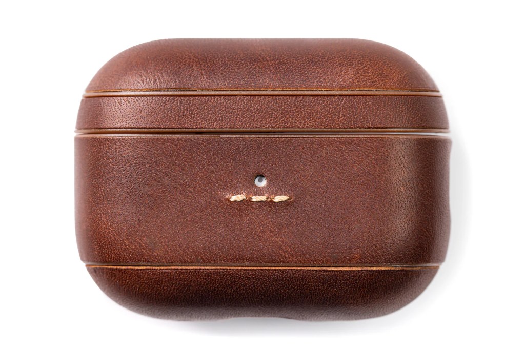 A brown leather case with a white background