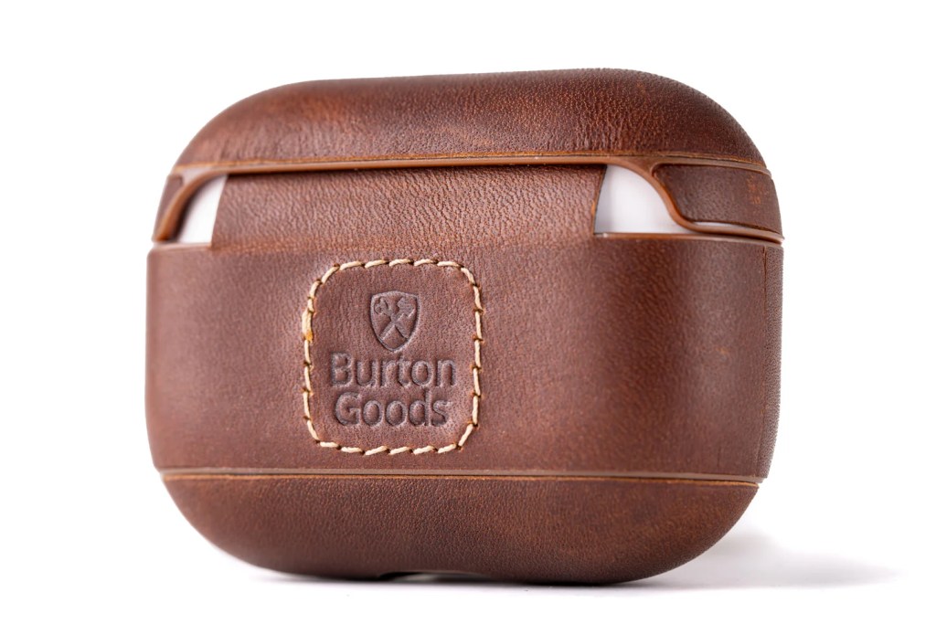A brown leather case with a logo on it