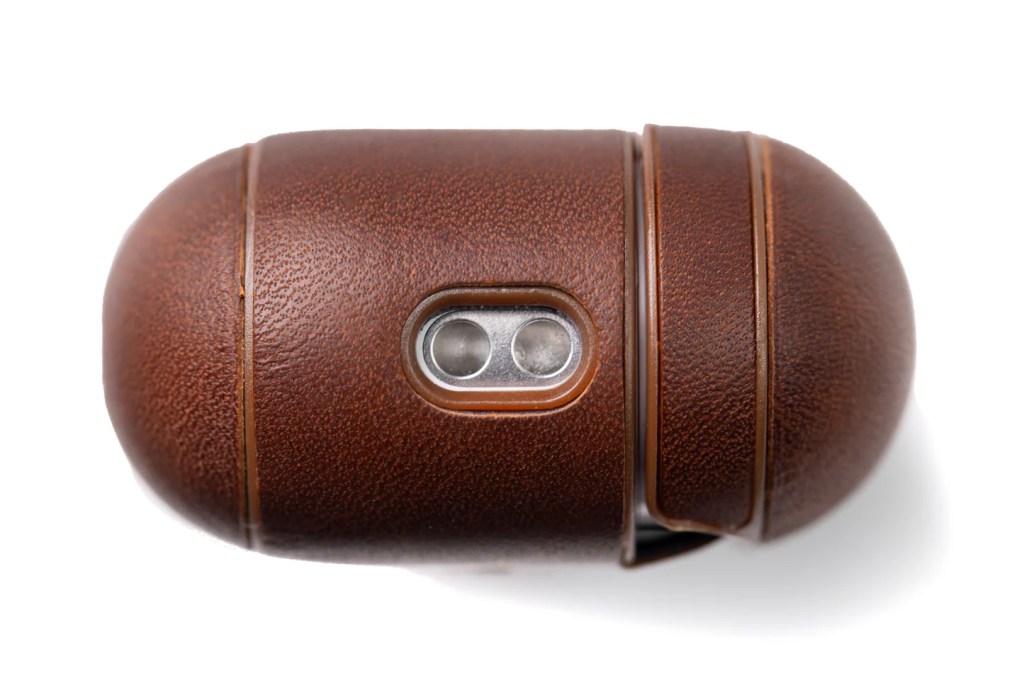 A brown leather case with a hole