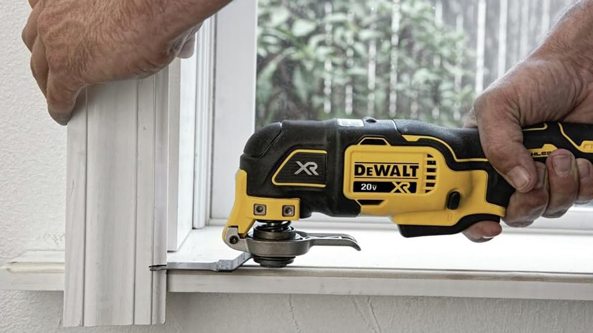 A yellow and black tool on a window sill