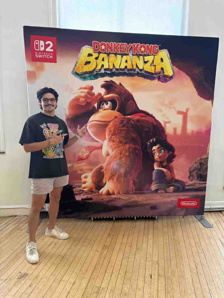 A man standing in front of a poster
