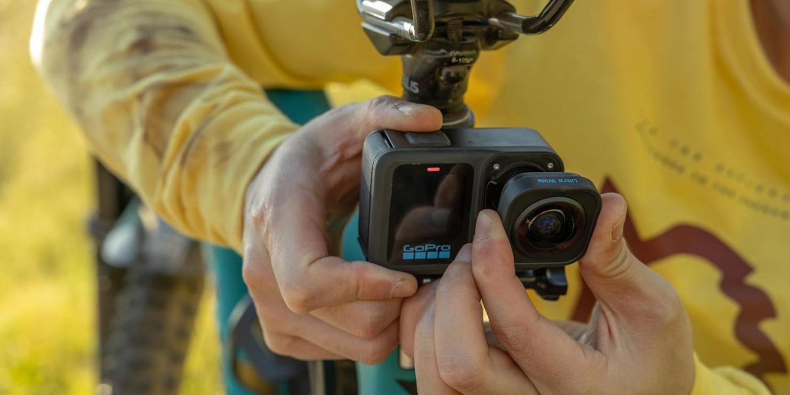 Image showing a person using GoPro's HERO13 Black action camera with the ultrawide lens mod.