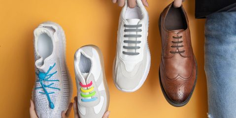 A group of people holding shoes