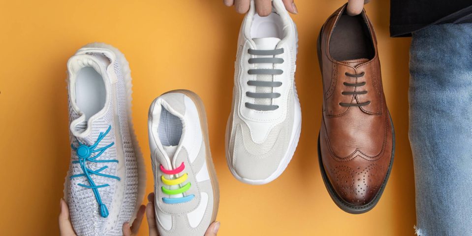 A group of people holding shoes