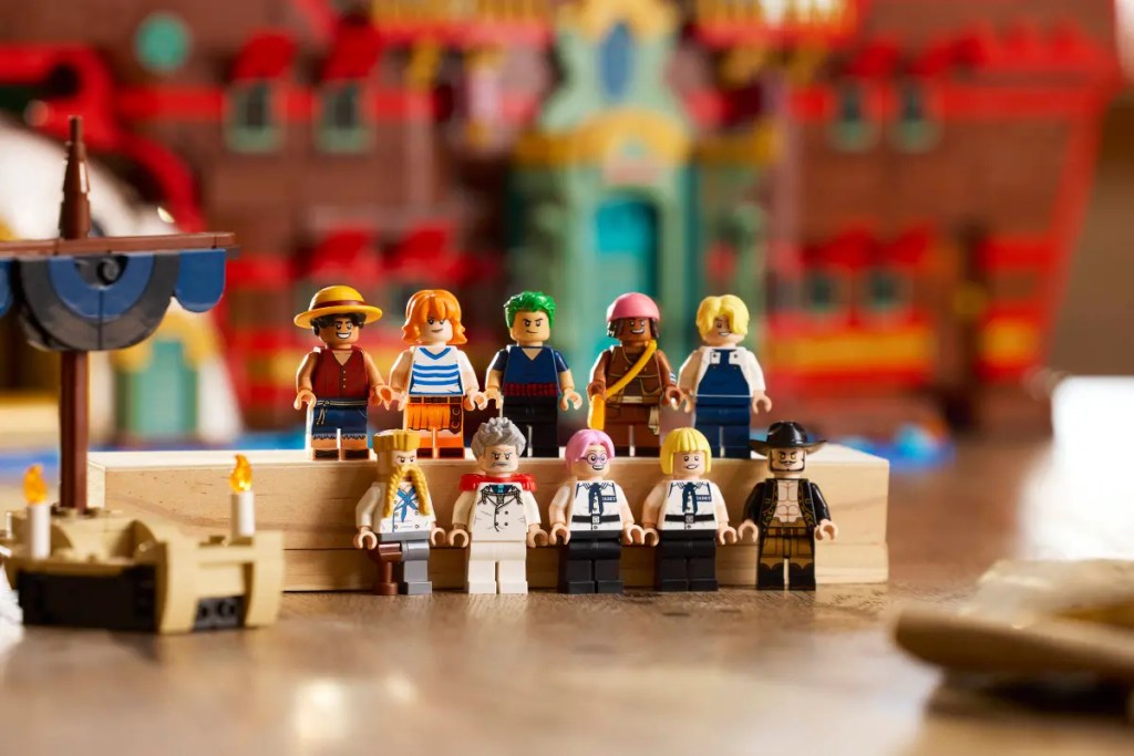A group of lego figures on a wooden surface