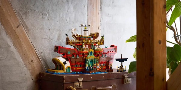 A toy building on top of a suitcase