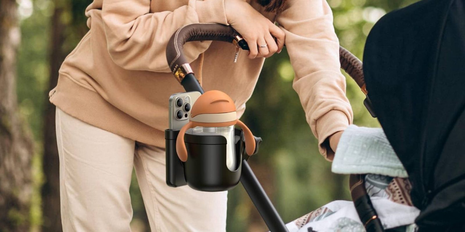 A person holding a baby stroller