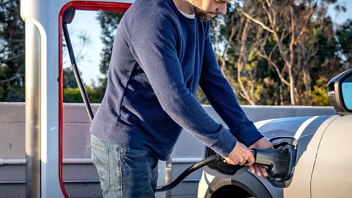 A man filling up a car
