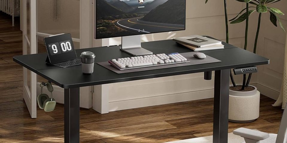 A desk with a computer and a laptop