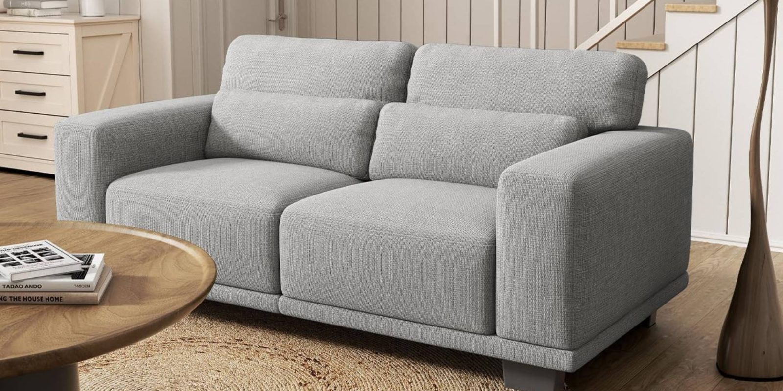 A grey couch in a room