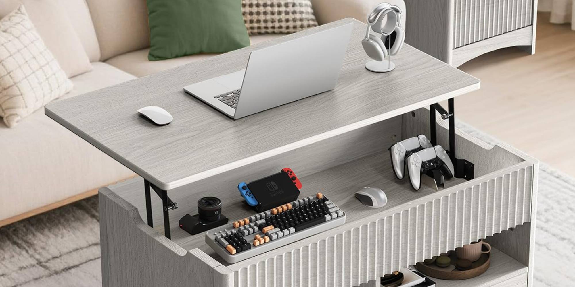 A desk with a laptop and gaming equipment