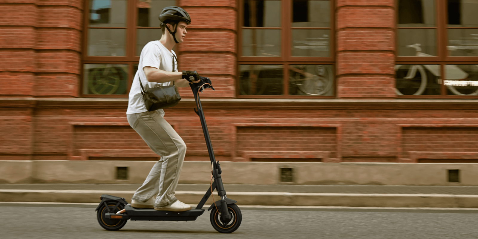 A man riding a scooter