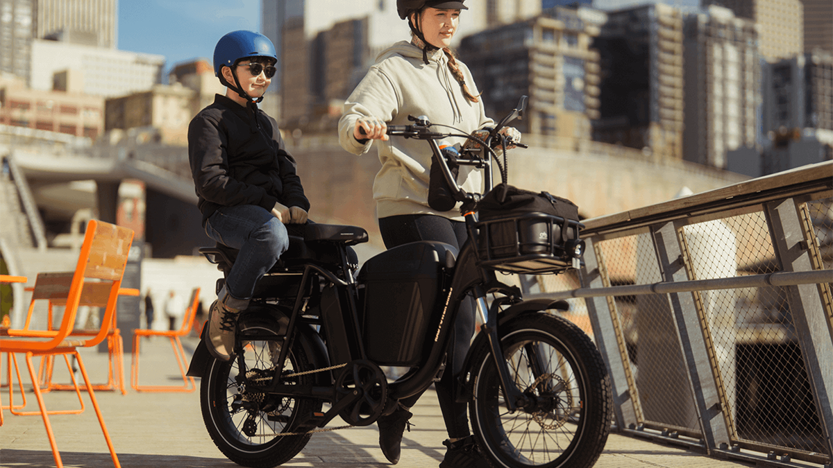 A woman and boy on a motorcycle