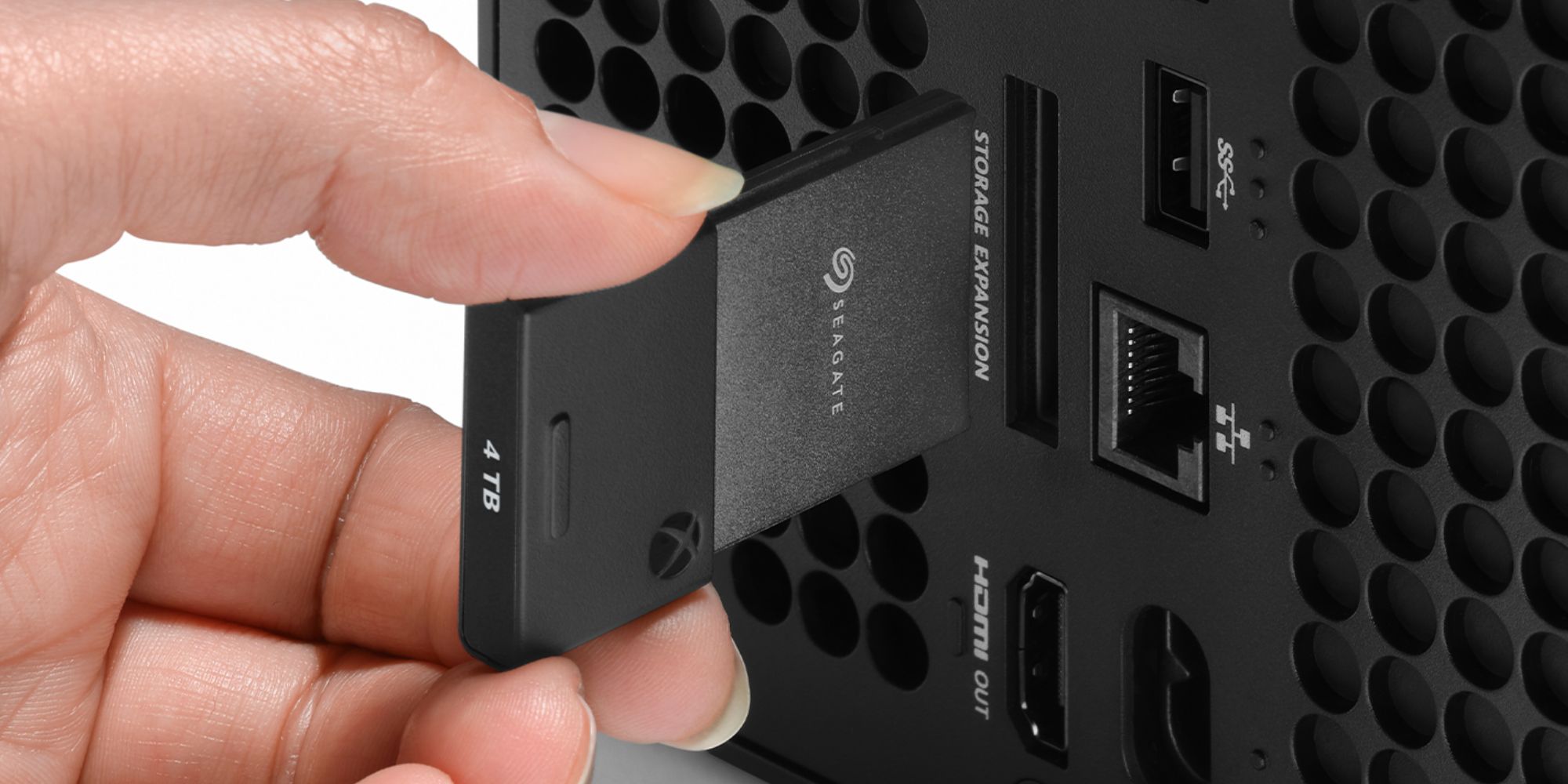 Image showing a person using Seagate 4TB Xbox Expansion card.