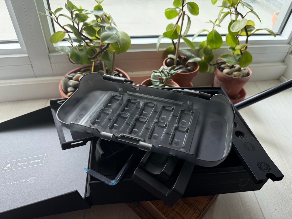 A black box with a lid on top of a black box with a black box and a black box with a black lid and a black box with a black lid and a black box with a black