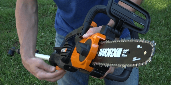 A person holding a chainsaw