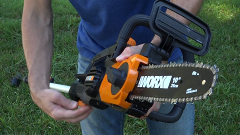 A person holding a chainsaw