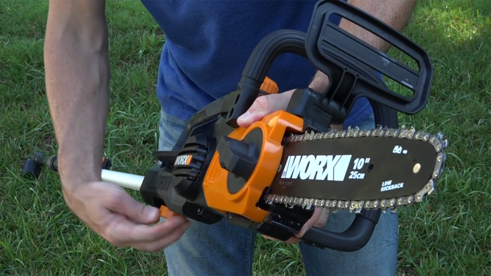 A person holding a chainsaw