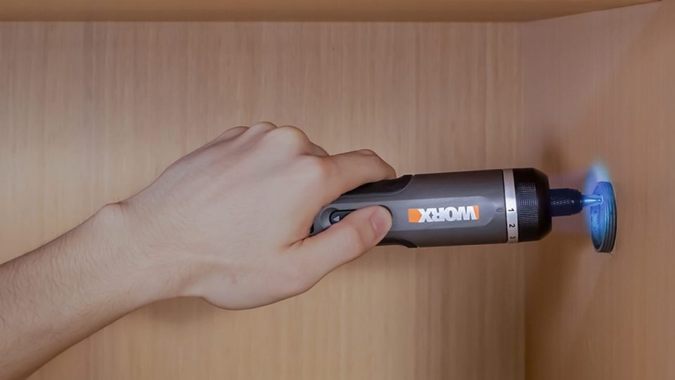 A hand holding a flashlight
