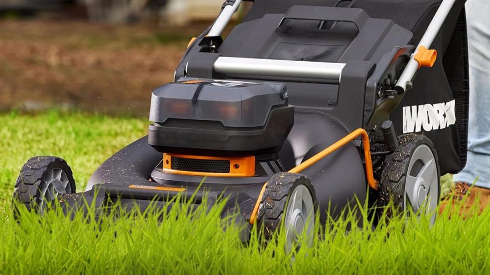 A lawn mower in the grass