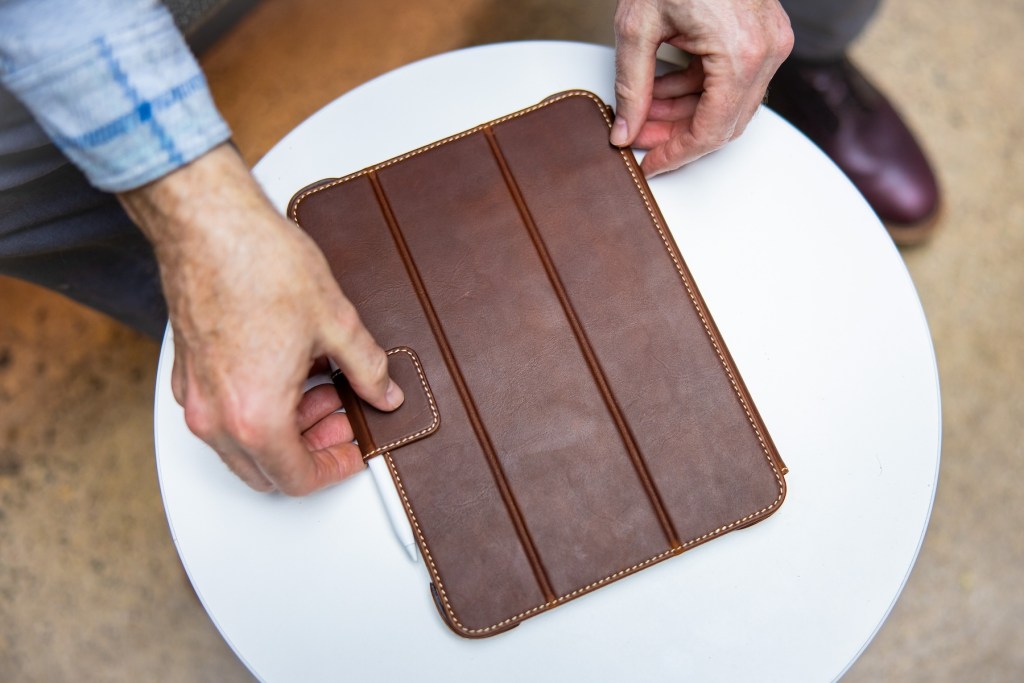 A person holding a tablet
