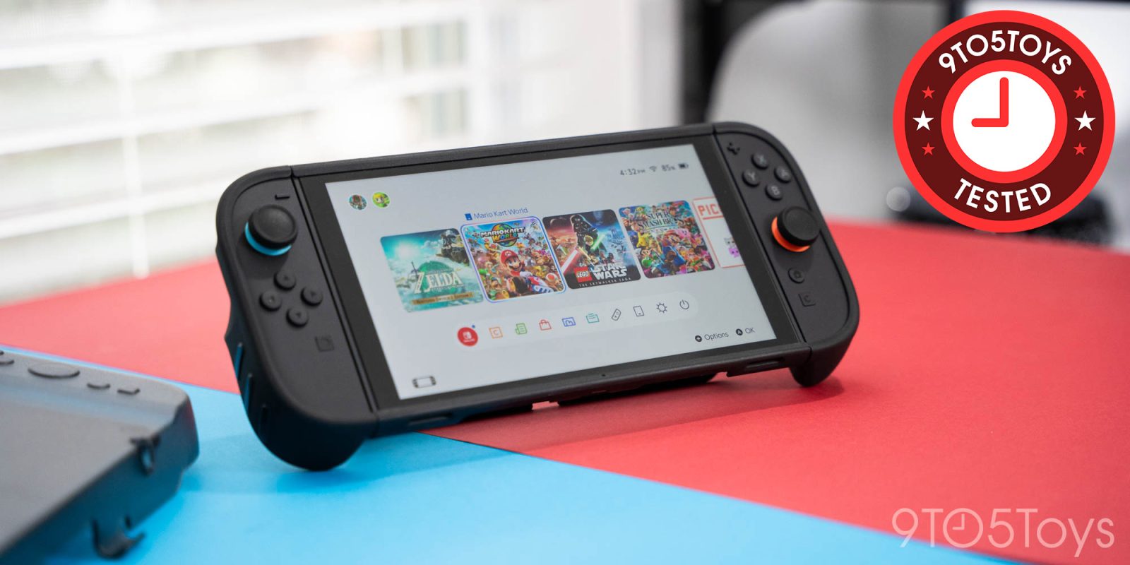 A black gaming device with a red and blue background