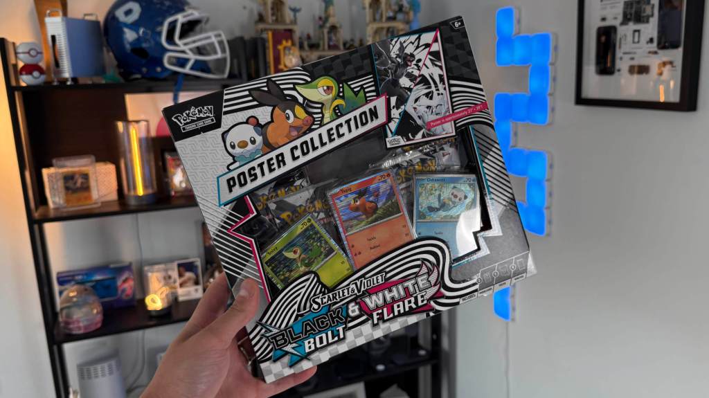 A hand holding a box of toys