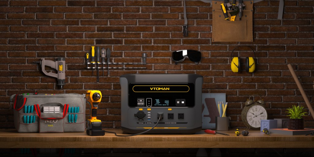 A black and yellow electrical device on a wood surface