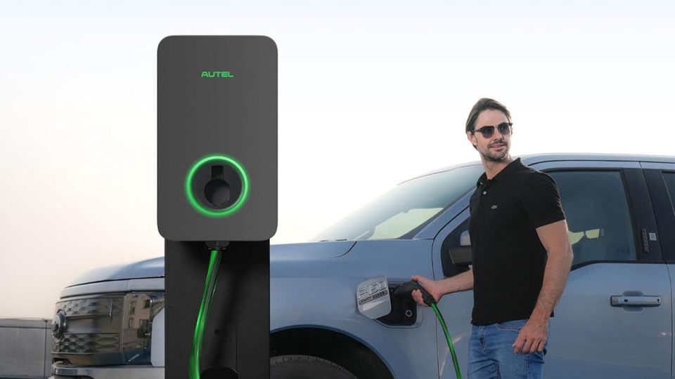 A man standing next to a car