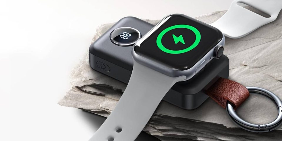 A smart watch with a white band on top of a black device