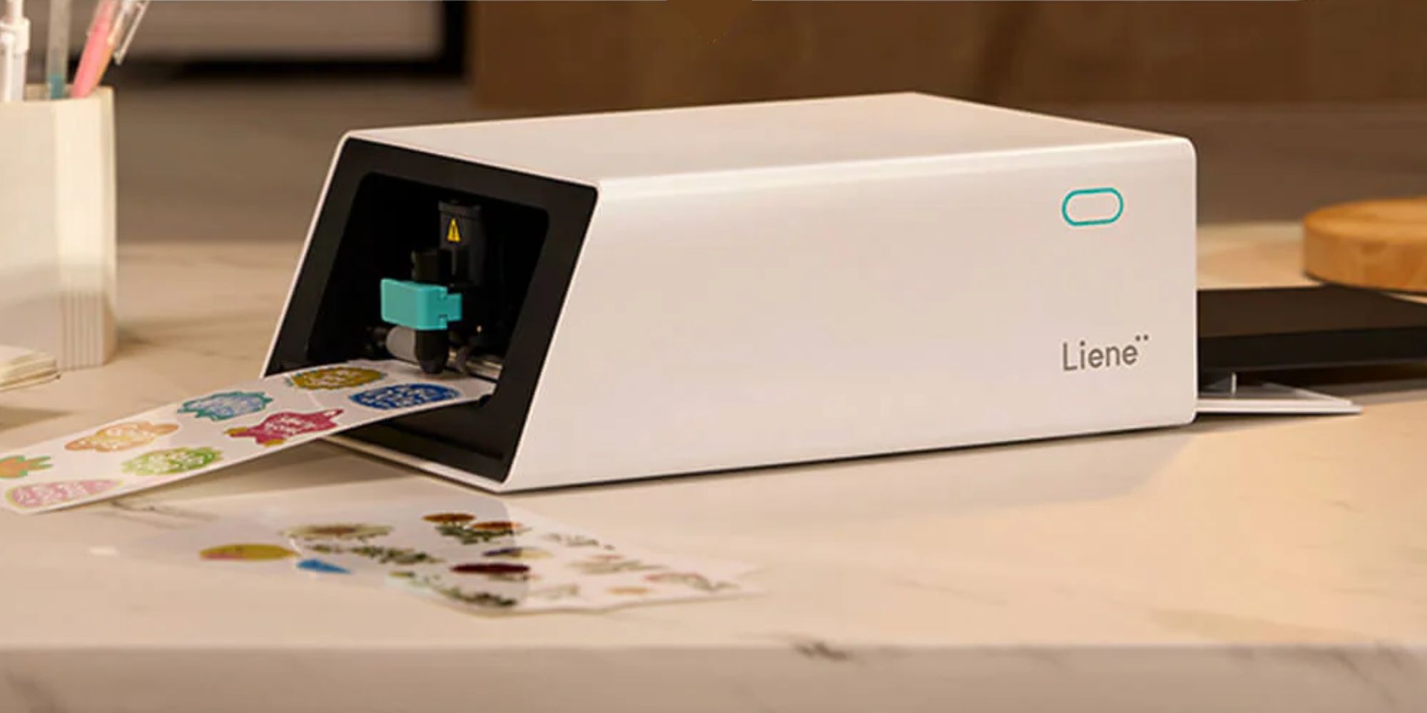 Image showing a render of Liene's PixCut S1 printing and cutting machine.