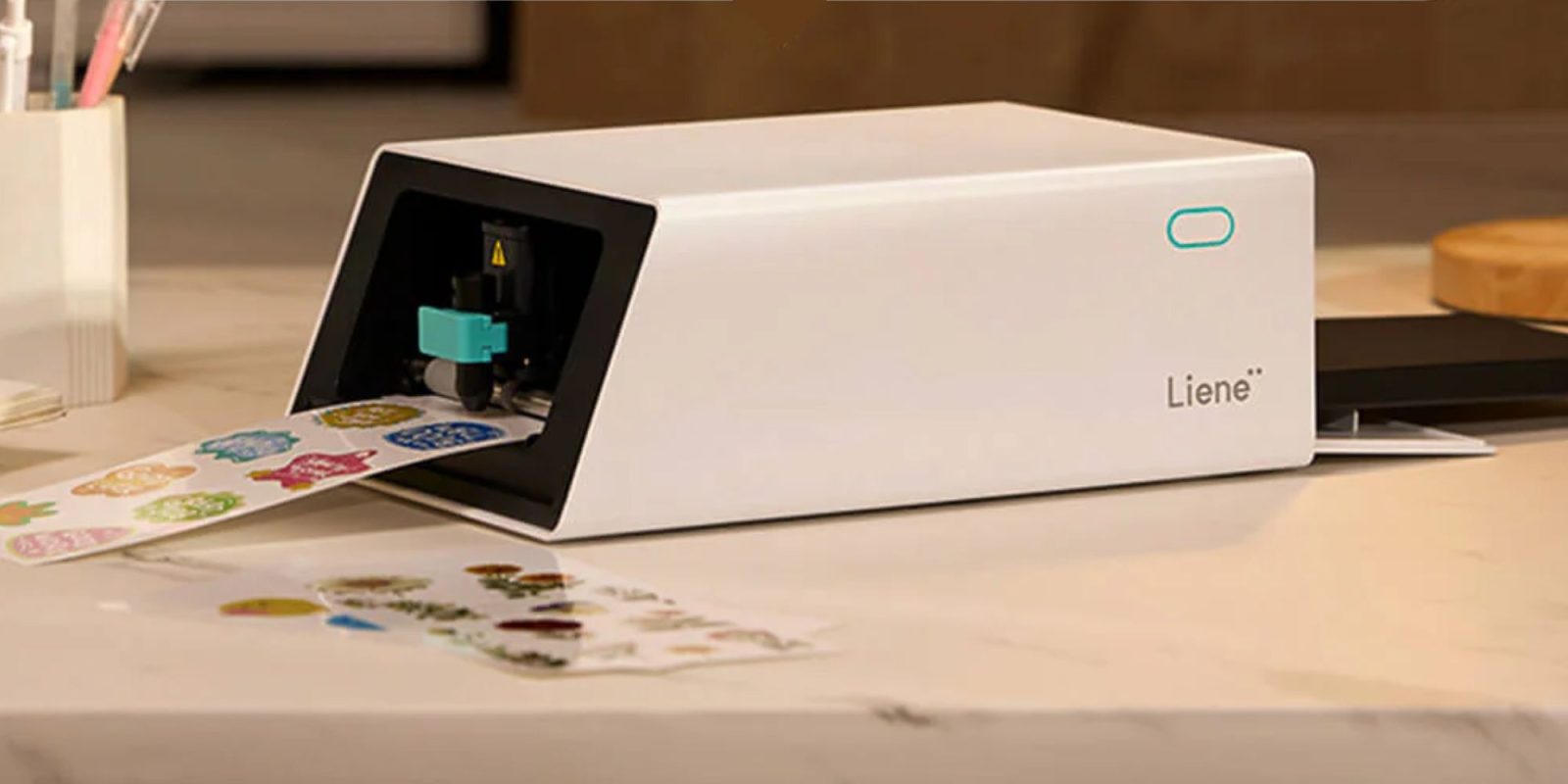 Image showing a render of Liene's PixCut S1 printing and cutting machine.